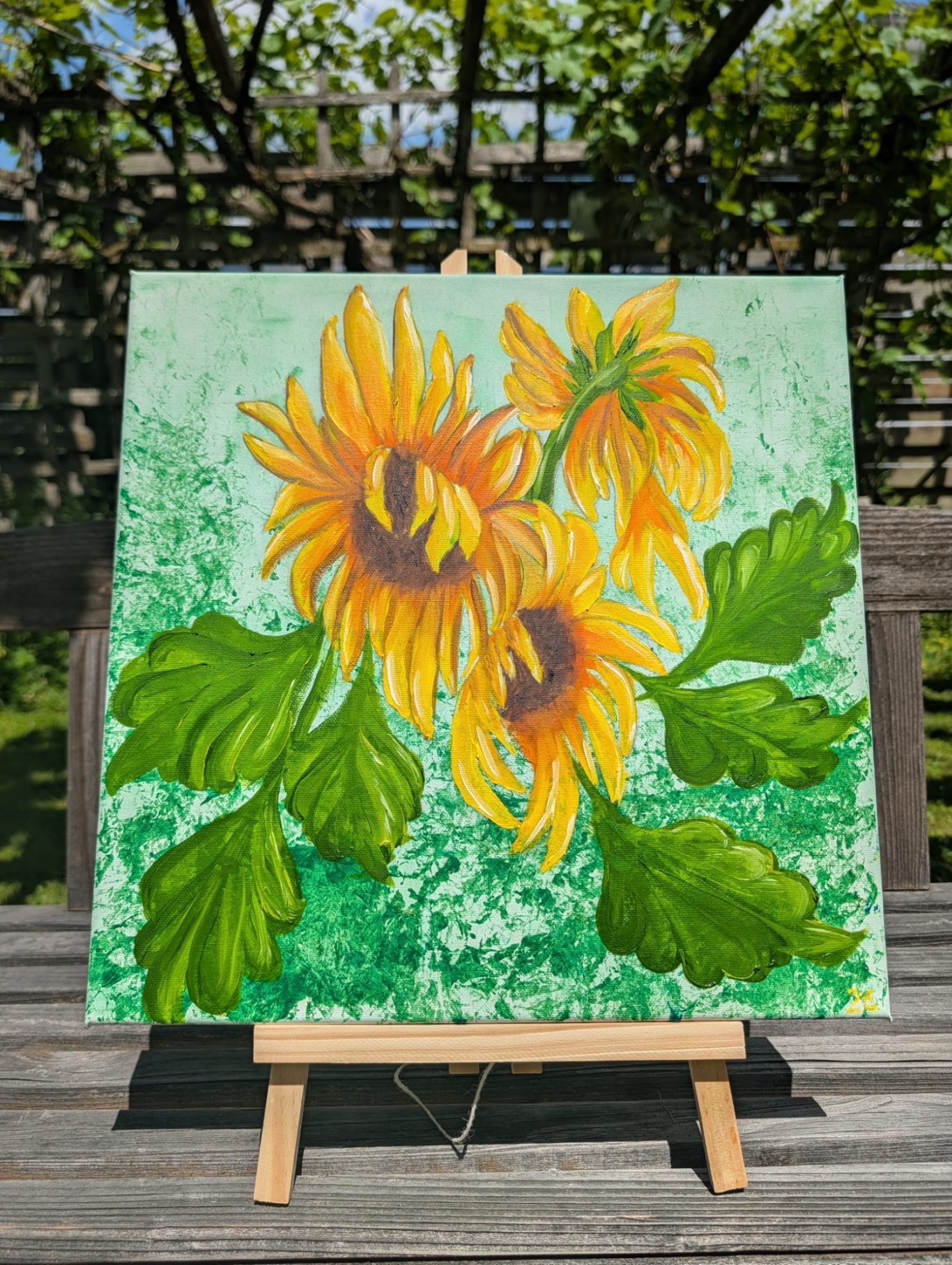 Sonnenblumen Trio Gelbe Sonnenblumen mit grünen Blättern auf grünem Hintergrund, auf einer Leinwand gemalt.